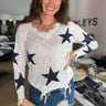 lightweight v-neck long sleeve americana style sweater with frayed hem and star print in navy on the front and sleeves