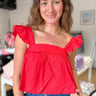 flowy sleeveless crop top with ruffle strap detail and square neck and back in bright red