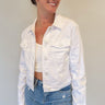 bright white classic style denim jacket that hits at the waistline, women's style, button front with chest and side pockets, collar and long sleeves