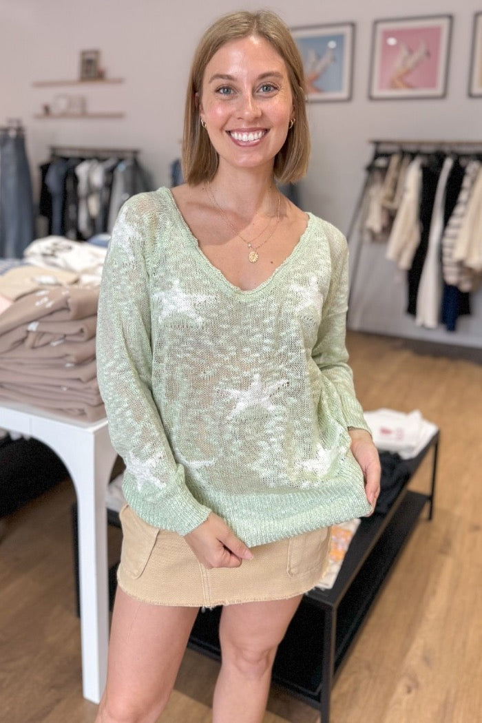 sheer v-neck lightweight sweater in sage with star print design throughout