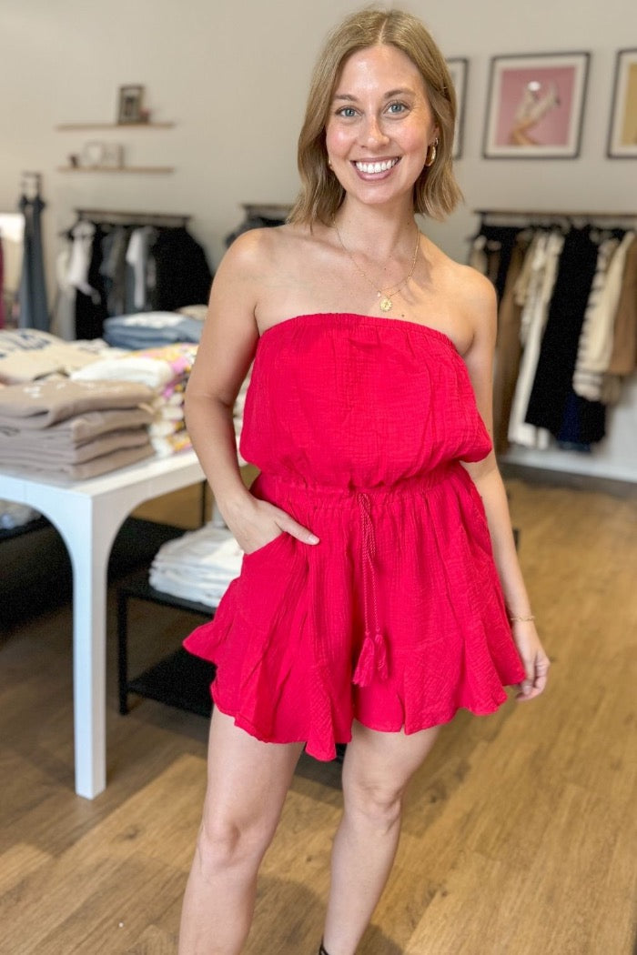 strapless tube top gauzy romper in red with elastic tied waist and ruffle detail on shorts, plus side pockets