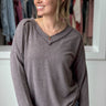 long sleeve, v-neck top with  raw edge detail in heather brown