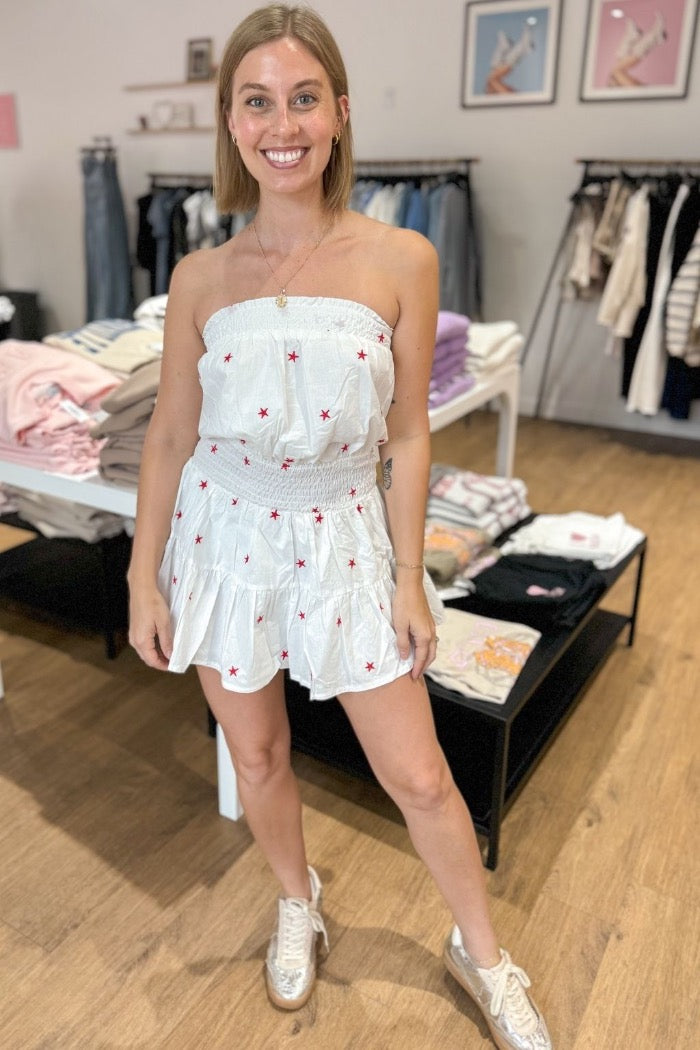 strapless romper with tiered skirt design featuring shorts underneath, with elastic top and waist for comfort and fit and star pattern throughout